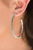 A studded silver hoop swings from the ear in a trendsetting fashion. Earring attaches to a standard post fitting. Hoop measures approximately 2"" in diameter.  Sold as one pair of hoop earrings.