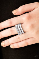 Featuring refined marquise cuts, glittery white rhinestones flare from a center of glassy white rhinestones, creating a regal band across the finger. Features a stretchy band for a flexible fit.  P4RE-WTXX-280XX