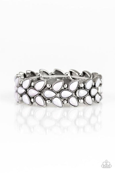 Faceted gray teardrop beads and shimmery silver studs coalesce into ornate frames. The whimsical frames are threaded along stretchy bands around the wrist for a seasonal look. Sold as one individual bracelet.  P9WH-SVXX-176XX
