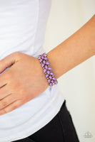 Faceted purple teardrop beads and shimmery silver studs coalesce into ornate frames. The whimsical frames are threaded along stretchy bands around the wrist for a seasonal look. Sold as one individual bracelet.  P9WH-PRXX-189XX