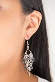 Glassy white teardrops cascade from an ornate silver frame, creating a dainty lure. Earring attaches to a standard fishhook fitting. Sold as one pair of earrings.  P5WH-WTXX-168XX