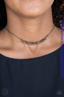 Dainty gunmetal rings swing from a dainty gunmetal chain, creating a flirtatious fringe. Features an adjustable clasp closure. Sold as one individual choker necklace. Includes one pair of matching earrings.  P2CH-BKXX-053XX
