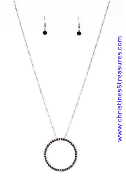 2018 October Fashion Fix Exclusive Encrusted in glittery red rhinestones, a dramatic silver hoop swings from the bottom of a lengthened silver chain for a refined look. Features an adjustable clasp closure. Sold as one individual necklace. Includes one pair of matching earrings.