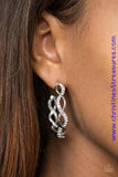 Encrusted in glassy rhinestones, a glittery white ribbon crisscrosses with a glistening silver ribbon, braiding into a refined hoop. Hoop measures 1 1/2" in diameter. Earring attaches to a standard post fitting. Sold as one pair of hoop earrings.  P5HO-SVWT-103XX