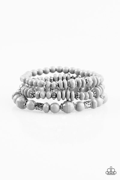 Varying in shape and shimmer, shiny gray beads are threaded along three elastic stretchy bands. Infused with dainty silver accents, the colorful bracelets stack across the wrist for a refined look.  P9WH-SVXX-131XX