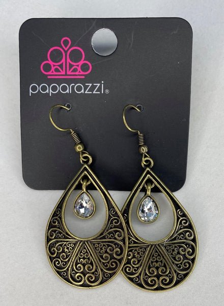 2021 January Fashion Fix Exclusive  Vine-like filigree climbs the center of an oversized brass teardrop, adorn with a white rhinestone. Earring attaches to a standard fishhook fitting. Sold as one pair of earrings.  P5WH-BRXX-124XX
