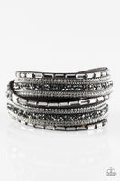 Varying in cut and shimmer, smoky, hematite, and white rhinestones are sprinkled along gray suede bands for a sassy look. The elongated design allows for a trendy double wrap around the wrist. Features an adjustable snap closure.  P9DI-URSV-070XX