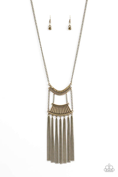 Encrusted in glittery aurum rhinestones, a bowing brass pendant attaches to an ornate brass frame, creating a bold pendant. Infused with an elongated brass chain, the tribal inspired pendant gives way to a shimmery brass fringe for a fierce finish. Features an adjustable clasp closure. Sold as one individual necklace. Includes one pair of matching earrings.  P2TR-BRXX-066XX