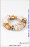 BLOCKBUSTER  Chunky peach beads combine with intricate silver details on a stretchy band. Matches Blockbuster Necklace. Sold as one individual bracelet.   Get The Complete Look! Necklace: "In Good Glazes - Peach" (Sold Separately)  P9RE-OGSV-010XX