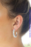 Encrusted in glassy white rhinestones, a thick silver hoop curls around the ear for a glamorous look. Earring attaches to a standard post fitting. Hoop measures 1" in diameter. Sold as one pair of hoop earrings. P5HO-WTXX-048XX
