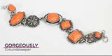 2020 Convention Exclusive Piece  Featuring vivacious orange stone centers, a collection of antiqued silver frames link with a decorative floral charm around the wrist for a seasonal flair. Features an adjustable clasp closure. Sold as one individual bracelet.  P9SE-OGXX-129XX   