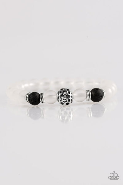 Infused with silver accents, glassy white and earthy black lava stones are threaded along a stretchy elastic band for a seasonal look. Sold as one individual bracelet.  P9SE-URBK-247XX