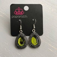 A faceted green teardrop gem is pressed into a shimmery silver frame radiating with studded details and glittery black rhinestones for a magnificent look. Earring attaches to a standard fishhook fitting. Sold as one pair of earrings.  P5ED-GRXX-027XX
