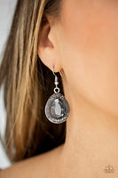 A faceted smoky teardrop gem is pressed into a shimmery silver frame radiating with studded details and glassy hematite rhinestones for a magnificent look. Earring attaches to a standard fishhook fitting. Sold as one pair of earrings.  P5ED-SVXX-055XX