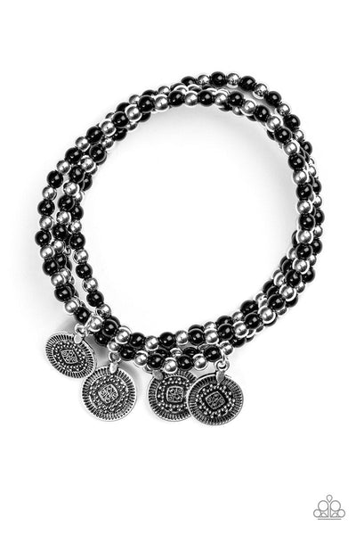 Dainty black and silver beads are threaded along stretchy elastic bands, creating colorful layers across the wrist. Brushed in an antiqued shimmer, ornate silver charms swing from the wrist for a wanderlust finish. Sold as one set of four bracelets.  P9TR-BKXX-034XX