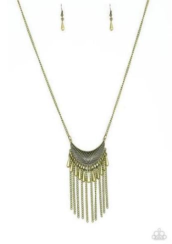 2018 October Fashion Fix Exclusive Radiating in linear textures, a glistening brass crescent swings from the bottom of a lengthened brass chain. Shimmery brass chains and flared brass beading swings from the bottom of the tribal inspired pendant, creating a flirtatious fringe. Features an adjustable clasp closure. Sold as one individual necklace. Includes one pair of matching earrings.  P2TR-BRXX-097XX