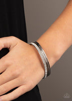 Pairs of smooth and hammered silver bangles join a white rhinestone encrusted bracelet around the wrist, creating an edgy stack of sparkle. Sold as one set of five bracelets.  P9RE-WTXX-406XX