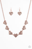 Featuring filigree-filled centers, glistening copper heart frames connect below the collar in a romantic fashion. Features an adjustable clasp closure. Sold as one individual necklace. Includes one pair of matching earrings.  Get The Complete Look! Bracelet: "Heartfelt Harmony - Copper" (Sold Separately)  P2WH-CPXX-127VG