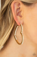 Encrusted in sections of glittery white rhinestones, a glistening gold hoop curls into a charming heart shape for a heart-stopping look. Earring attaches to a standard post fitting. Hoop measures approximately 2" in diameter. Sold as one pair of hoop earrings. P5HO-GDXX-133XX