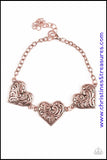 Featuring filigree-filled centers, glistening copper heart frames connect around the wrist in a romantic fashion. Features an adjustable clasp closure. Sold as one individual bracelet.  Get The Complete Look! Necklace: "Heart Heaven - Copper" (Sold Separately)  P9WH-CPXX-100VG