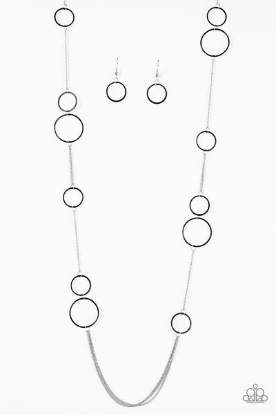 Tinted in a bold finish, shiny black hoops trickle along dainty silver chain, creating a colorful asymmetrical palette. Features an adjustable clasp closure. Sold as one individual necklace. Includes one pair of matching earrings. P2WH-BKXX-187XX