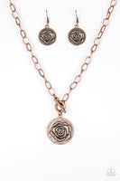 Embossed in a whimsical rosebud pattern, a shimmery copper frame swings below the collar for a casual look. Features a toggle closure. Sold as one individual necklace. Includes one pair of matching earrings. P2WH-CPXX-139XX