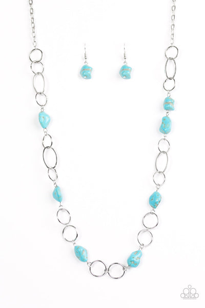 Refreshing turquoise stone beading trickles along shimmery silver hoops, creating a colorfully earthy palette. Features an adjustable. Sold as one individual necklace. Includes one pair of matching earrings. P2SE-BLXX-245XX