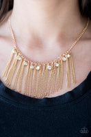 Glittery white rhinestones trickle between freefalling gold chains, creating a fierce fringe below the collar. Features an adjustable clasp closure. Sold as one individual necklace. Includes one pair of matching earrings.  P2RE-GDXX-169XX