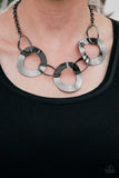 2018 Convention Exclusive Featuring slightly warped surfaces, asymmetrical gunmetal hoops link with reflective gunmetal rings below the collar for a modern look. Features an adjustable clasp closure. Sold as one individual necklace. Includes one pair of matching earrings.  P2IN-BKXX-142XX