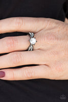 Encrusted in dazzling white rhinestones, glistening gunmetal bands attach to a glittery white rhinestone centerpiece, for a regal finish. Features a dainty stretchy band for a flexible fit. Sold as one individual ring. P4DA-BKXX-044XX