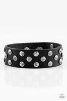 Encased in shimmery silver frames, glittery white rhinestones are sprinkled along a shiny black leather band for a dramatic look. Features an adjustable snap closure. Sold as one individual bracelet.  P9DI-URBK-124XX