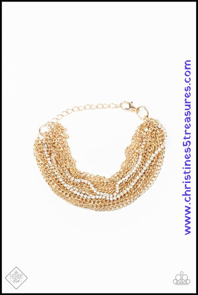2020 June Fashion Fix - Magnificent Musings  Infused with sporadic strands of glittery white rhinestones, countless shiny gold chains layer around the wrist to create a dramatic shimmer. Features an adjustable clasp closure. Sold as one individual bracelet. P9ED-GDXX-061TS