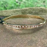 2020 March Fashion Fix Exclusive Gradually increasing in size at the center, two sections of peach rhinestones are encrusted along a dainty gold bangle rippling with wavy textures for a timeless twist. Sold as one individual bracelet.  P9RE-GDXX-183XX