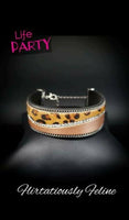 2019 October Life Of The Party Infused with strands of antiqued silver chains and glassy white rhinestones, wavy pieces of tan leather and cheetah print line the front of a black suede band for a fierce look. Features an adjustable clasp closure. Sold as one individual bracelet.  P9DI-URBN-092XX
