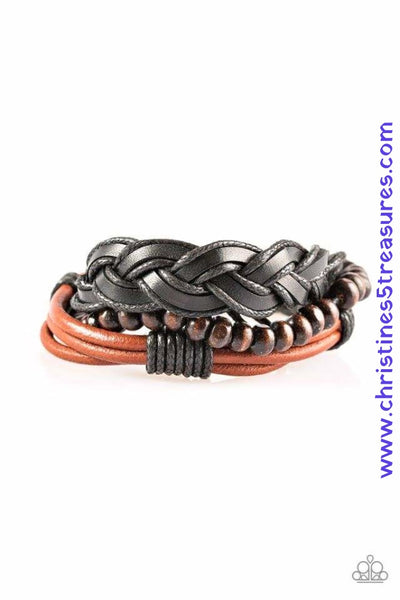 A mishmash of black braided twine and leather and strands of shiny brown leather cording layer across the wrist. A strand of wooden beads is added to the urban palette for an earthy finish. Features an adjustable sliding knot closure. Sold as one individual bracelet. P9UR-BNXX-286XX