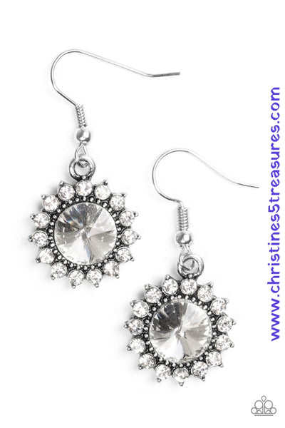 A glittery white rhinestone is pressed into a silver frame radiating with dainty white rhinestones for a glamorous look. Earring attaches to a standard fishhook fitting. Sold as one pair of earrings. P5RE-WTXX-272XX
