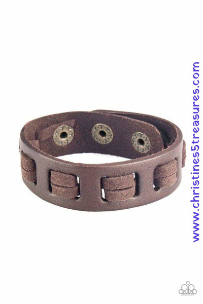 Brown suede laces are threaded along the front a leather band for a rugged look. Features an adjustable snap closure. Sold as one individual bracelet. P9UR-BNXX-376XX