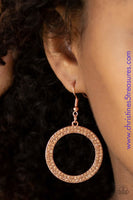 Two rows of glittery peach rhinestones are encrusted along a shiny copper circle, creating a bubbly frame. Earring attaches to a standard fishhook fitting. Sold as one pair of earrings. P5RE-CPSH-058XX