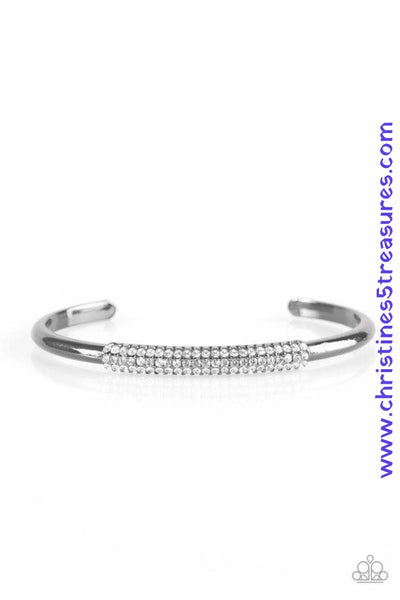 The center of a dainty gunmetal cuff is encrusted in row after row of glassy white rhinestones for a timeless look. Sold as one individual bracelet. P9RE-BKXX-181XX
