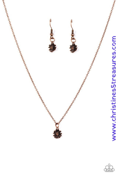 A dainty floral pendant swings from the bottom of a shimmery copper frame, creating a casual look below the collar. Features an adjustable clasp closure. Sold as one individual necklace. Includes one pair of matching earrings. P2DA-CPXX-089XX