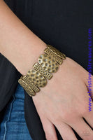Delicately hammered in antiqued detail, round and rectangular shaped frames are threaded along stretchy bands, creating a bold tribal look around the wrist. Sold as one individual bracelet.  P9TR-BRXX-061XX