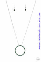 Encrusted in glittery green rhinestones, a dramatic silver hoop swings from the bottom of a lengthened silver chain for a refined look. Features an adjustable clasp closure. Sold as one individual necklace. Includes one pair of matching earrings.  P2RE-GRXX-152XX