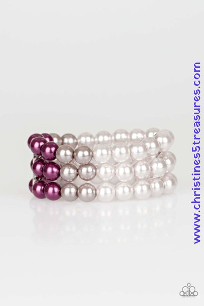 Joined together by a hammered silver fitting, dark gray, silver, and purple pearls are threaded along stretchy bands, creating an elegant ombre effect around the wrist. Sold as one individual bracelet.  Get The Complete Look! Necklace: "Times Square Starlet - Purple" (Sold Separately)  P9RE-PRXX-106OG
