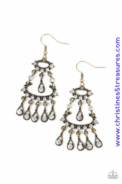 Dotted in dainty white rhinestones, stacked brass frames give way to a teardrop fringe encrusted in glassy white rhinestones, creating a refined chandelier. Earring attaches to a standard fishhook fitting. Featured inside The Preview at ONE Life! Sold as one pair of earrings.  P5RE-BRXX-106XX