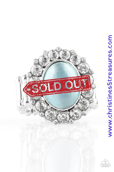 Glassy white rhinestones spin around a glowing blue moonstone center, creating a whimsical floral frame atop the finger. Features a stretchy band for a flexible fit.  P4RE-BLXX-137XX