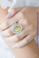 Glassy white rhinestones spin around a glowing yellow moonstone center, creating a whimsical floral frame atop the finger. Features a stretchy band for a flexible fit. Sold as one individual ring.  P4RE-YWXX-036XX