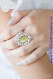 Glassy white rhinestones spin around a glowing yellow moonstone center, creating a whimsical floral frame atop the finger. Features a stretchy band for a flexible fit. Sold as one individual ring.  P4RE-YWXX-036XX