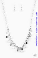 A classic strand of pearls gives way to a shimmery silver chain. White pearls and silver beads trickle from the bottom of the chain, adding a sassy to twist to the classic palette. Features an adjustable clasp closure. Sold as one individual necklace. Includes one pair of matching earrings. P2RE-WTXX-227XX