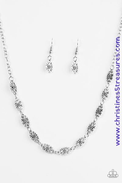 Brushed in an antiqued shimmer, dainty floral charms link below the collar for a seasonal look. Features an adjustable clasp closure. Sold as one individual necklace. Includes one pair of matching earrings.  Get The Complete Look! Bracelet: "Easy Daisy - Silver" (Sold Separately)  P2WH-SVXX-226WA