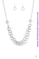 Two oversized silver pearls give way to dramatic silver chains, creating bold layers below the collar for a sassy look. Features an adjustable clasp closure. Sold as one individual necklace. Includes one pair of matching earrings.   P2IN-SVXX-183XX